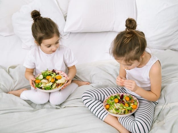 healthy food home happy two cute children eating fruits vegetables bedroom bed healthy food children teenagers 169016 4875