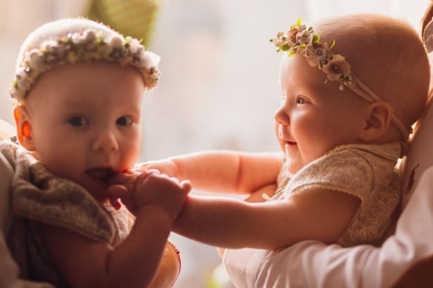 happy mom dad pose with funny twins their arms before bright window 8353 320